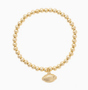 Gold beaded stretch bracelet with gold football charm for football fans.