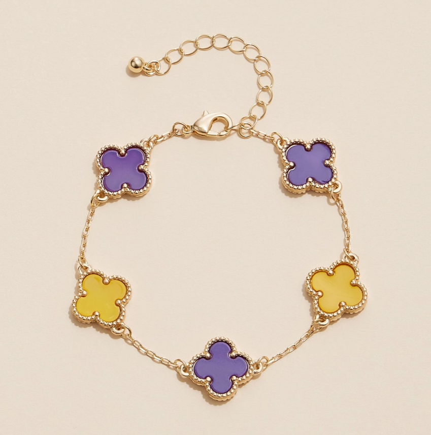 Gold bracelet with purple and yellow clover-shaped enamel charms for game day and LSU sports fans.