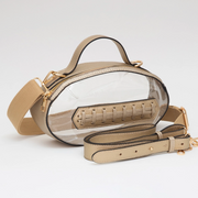 Gold leather football shaped clear purse for game day for LSU fans.